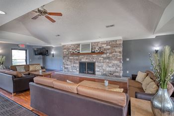 Clubhouse with great room, fireplace, flat screen tv, and patio for private entertaining